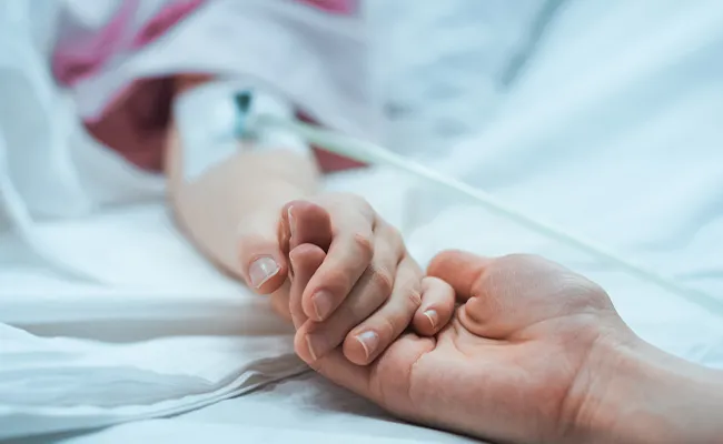 Holding hands in hospital